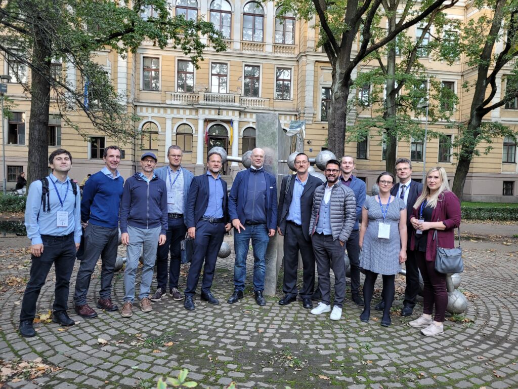 13th Paul Walden Symposium lectors and participants near monument devoted to Paul Walden, Riga 2023